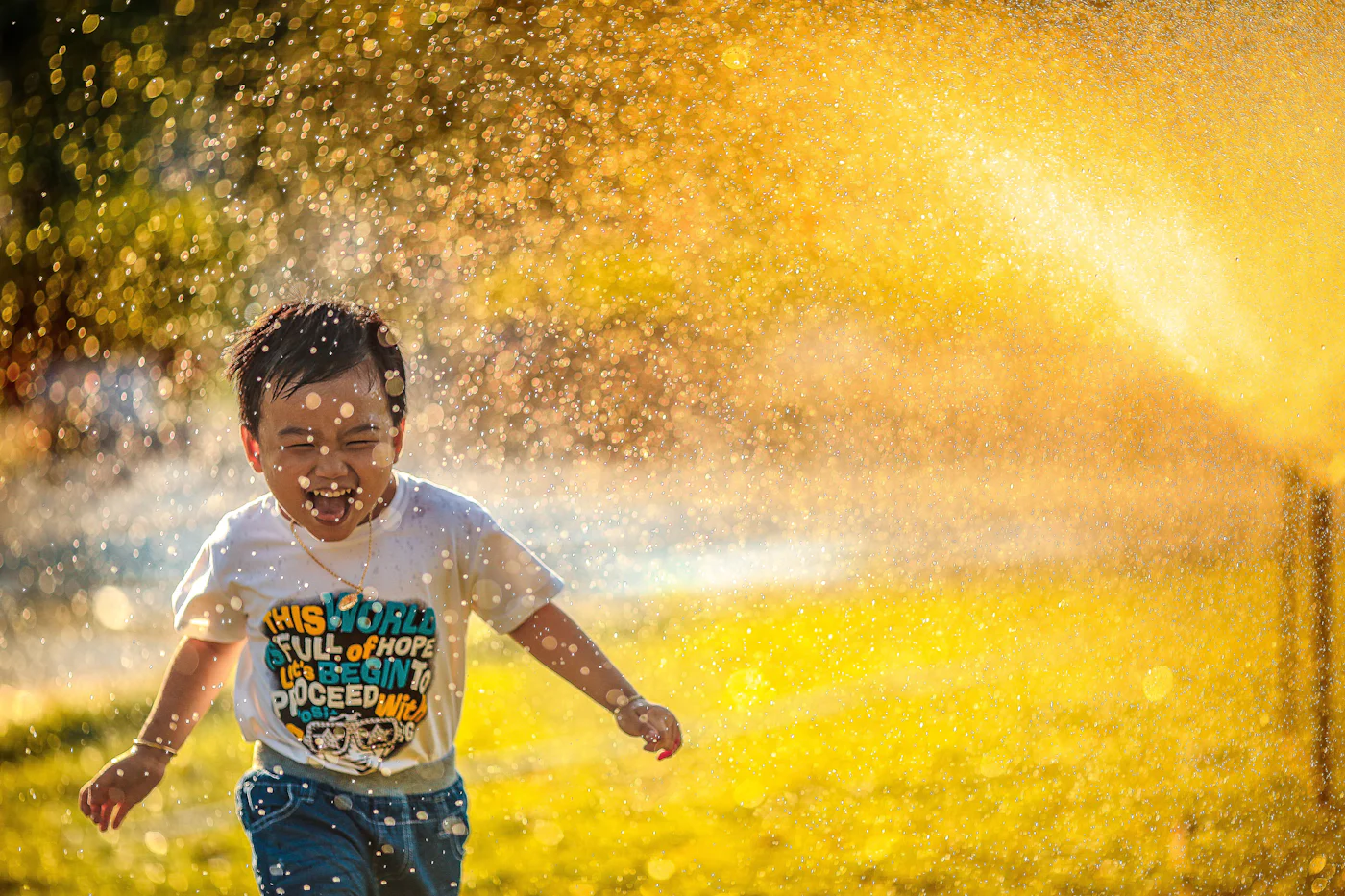 A joyful child playing outdoors during a respite care session with an associate